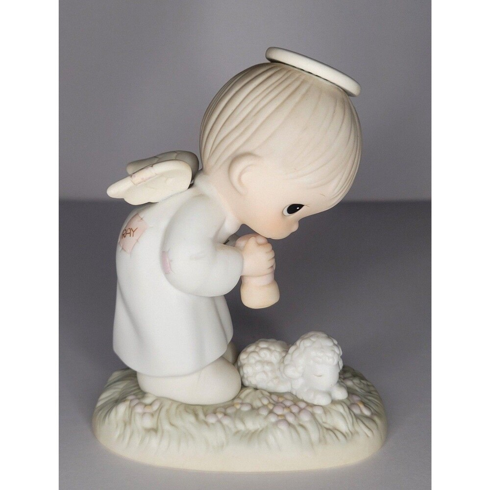 Precious Moments Figurine: PM841 God's Ray of Mercy (4.7")